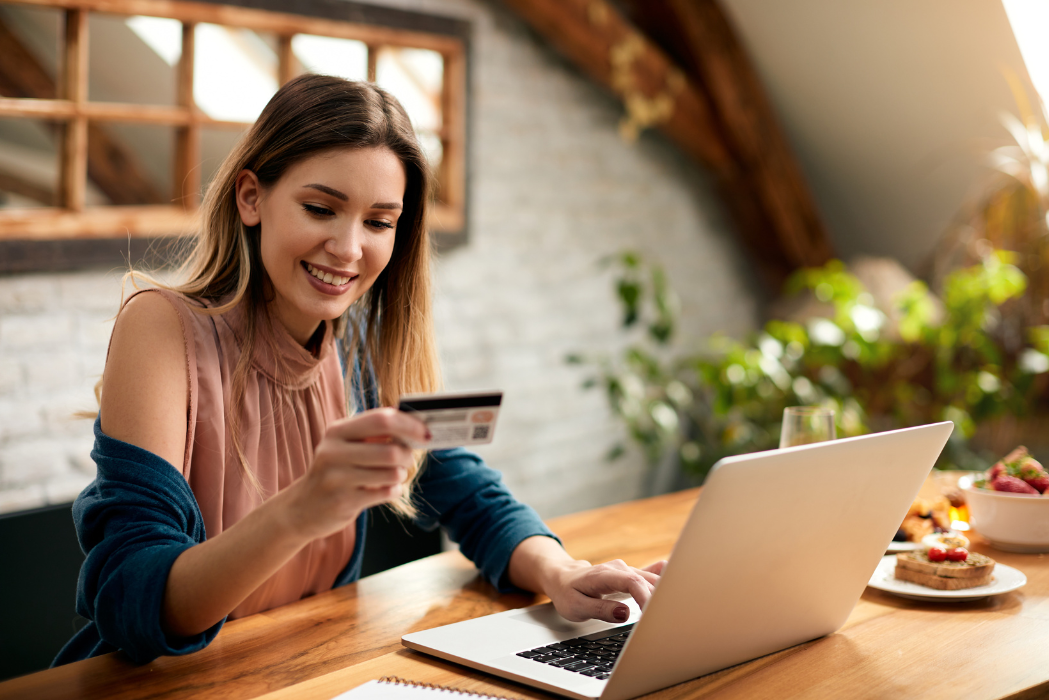 Woman using laptop in kitchen