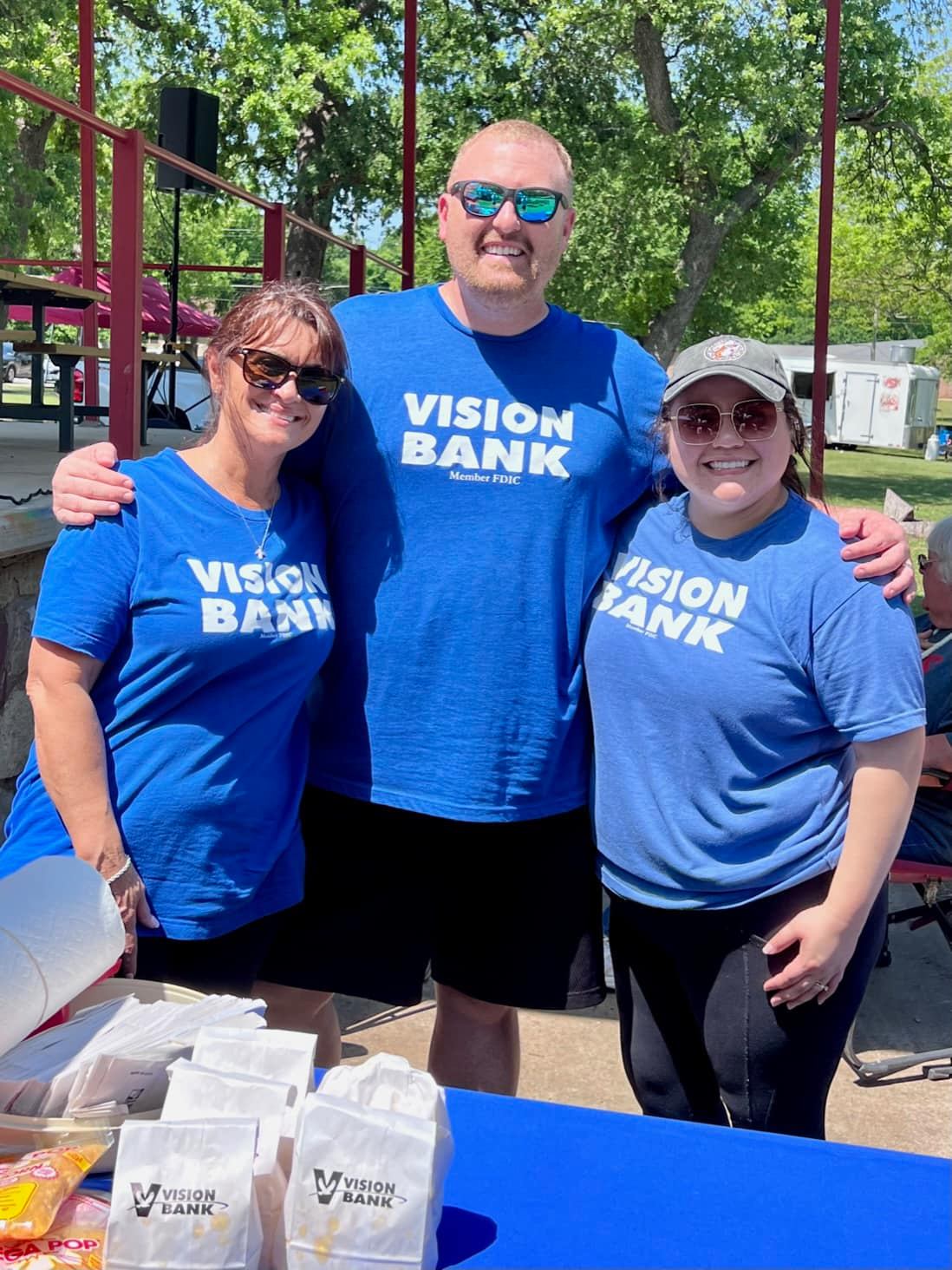 Vision Bank employees volunteering at community event. 