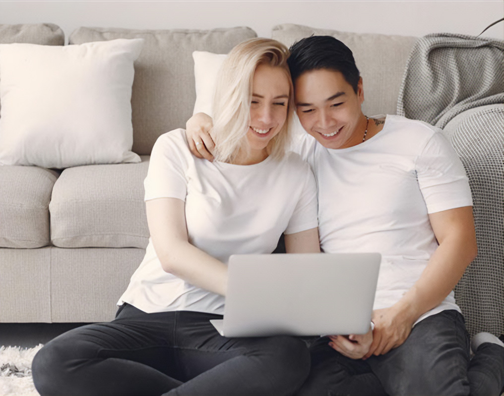 Young couple looking at computer