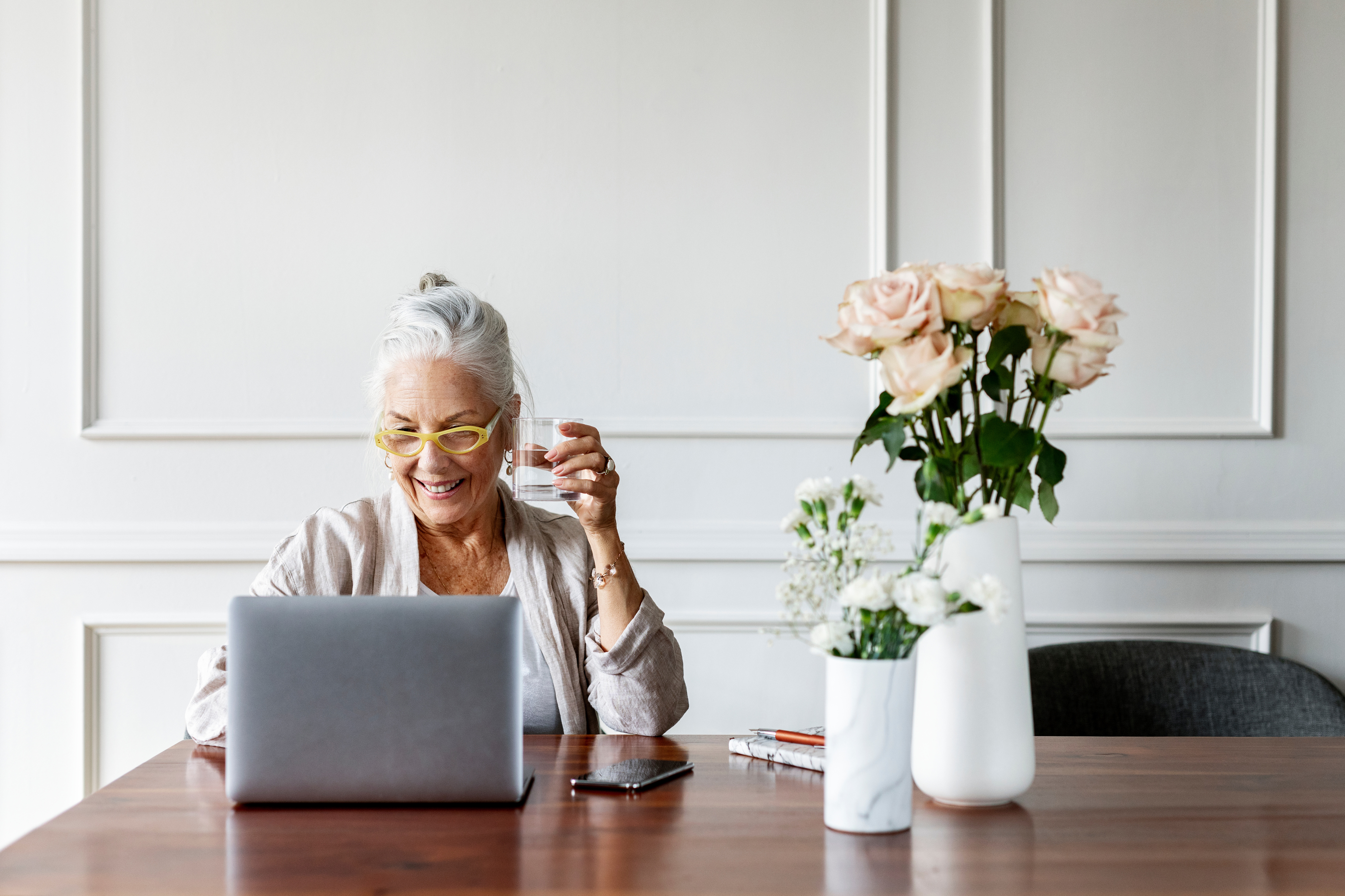 elderly woman in front of laptop.