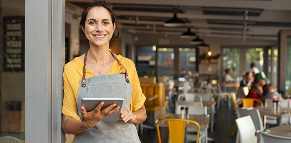 small business owner holding ipad