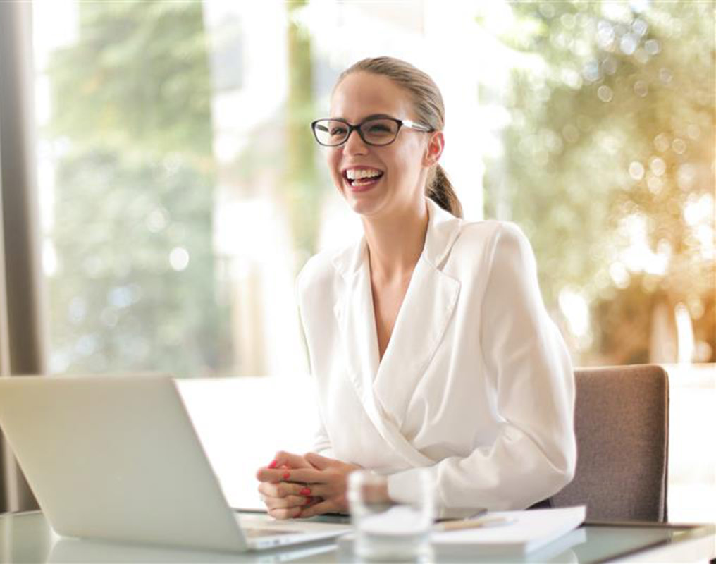 Woman using laptop in office