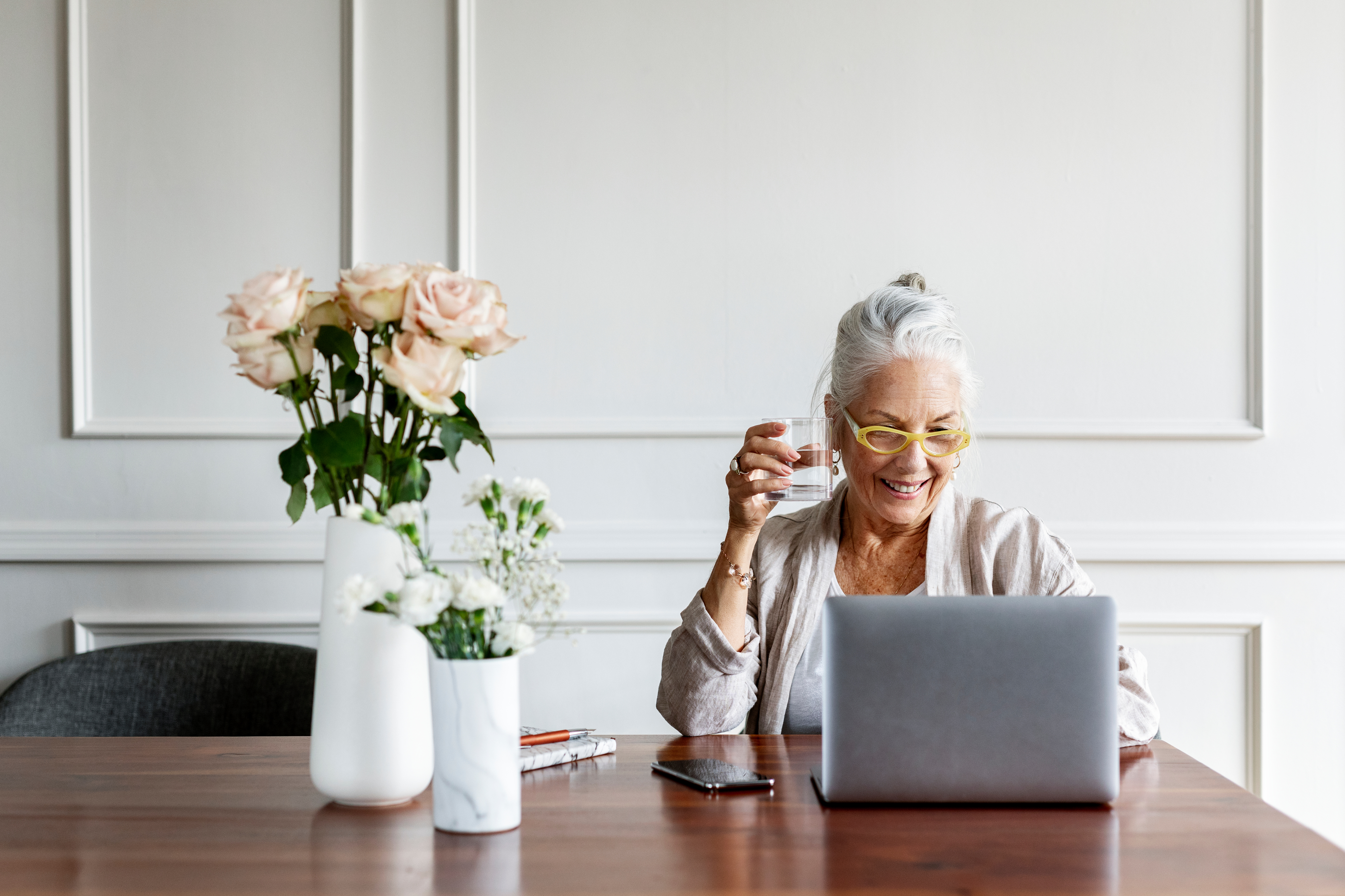 elderly woman in front of laptop.