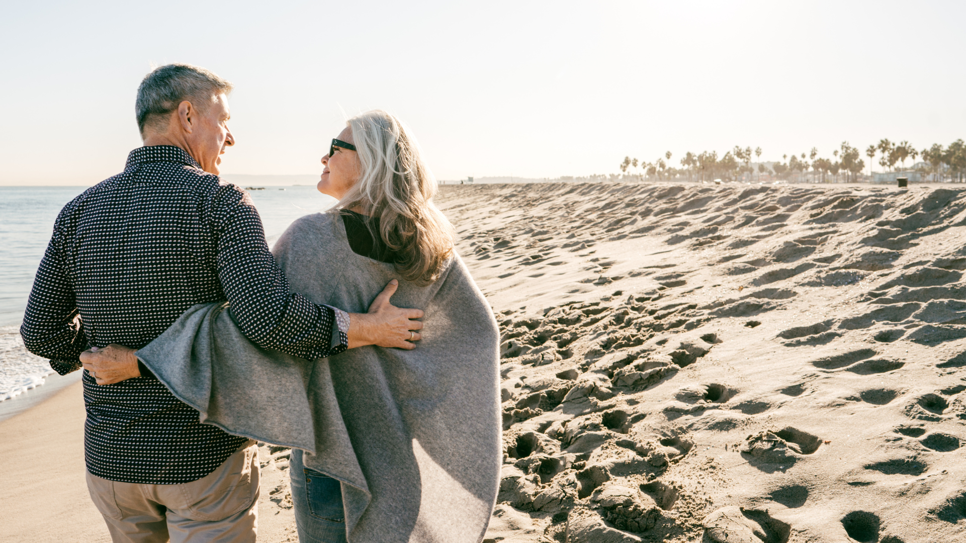 Couple walking along the beach