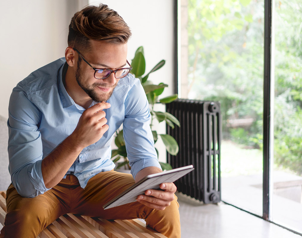 Young man using tablet in office