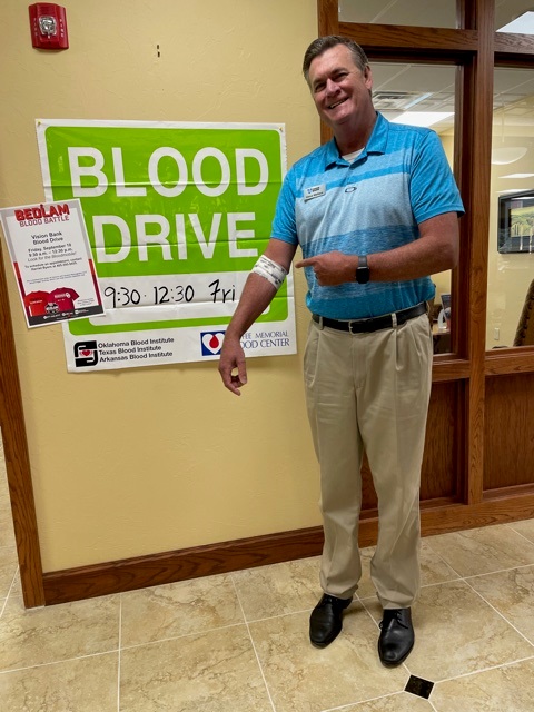 Shawnee president donates blood at blood drive. 