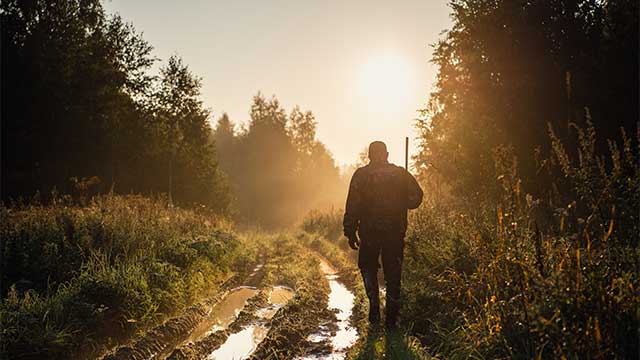 Man walking on hunting land
