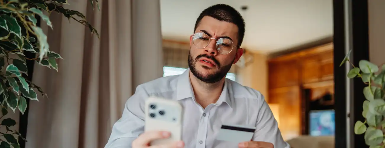 man looking concerned at phone