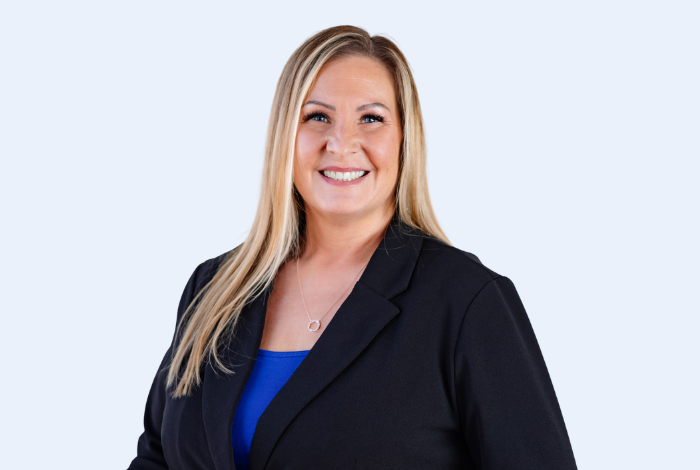Valerie Cook, Durant branch manager, headshot on blue background