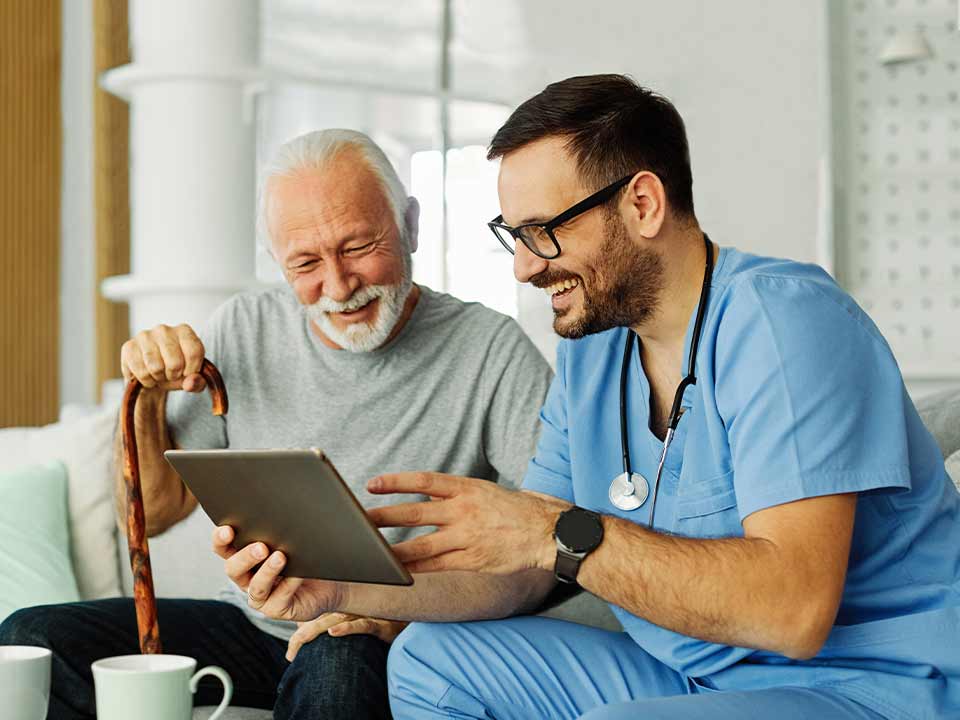 mature man meeting with doctor going over plan of care